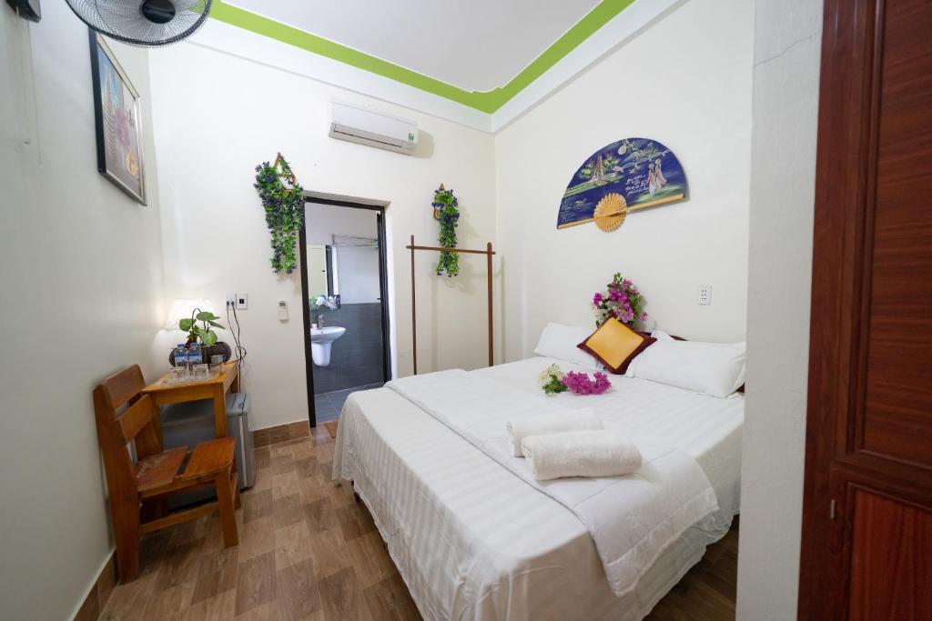 Postel nebo postele na pokoji v ubytování Diep Le Homestay