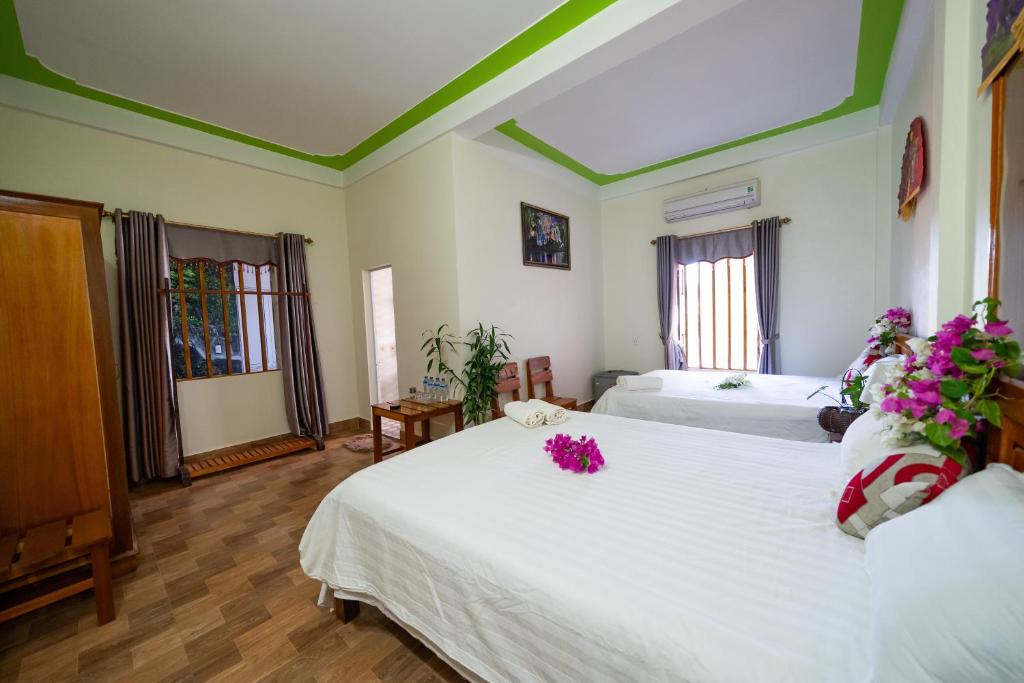 Postel nebo postele na pokoji v ubytování Diep Le Homestay