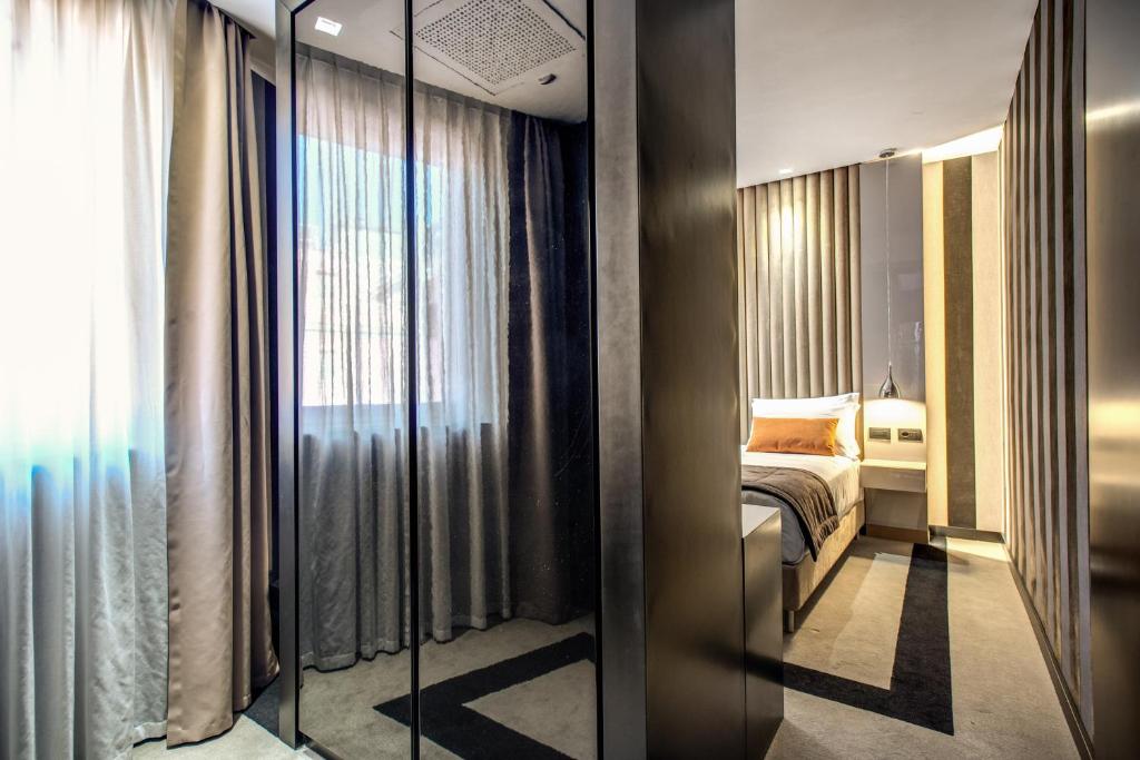 Postel nebo postele na pokoji v ubytování Doria Palace Boutique Hotel