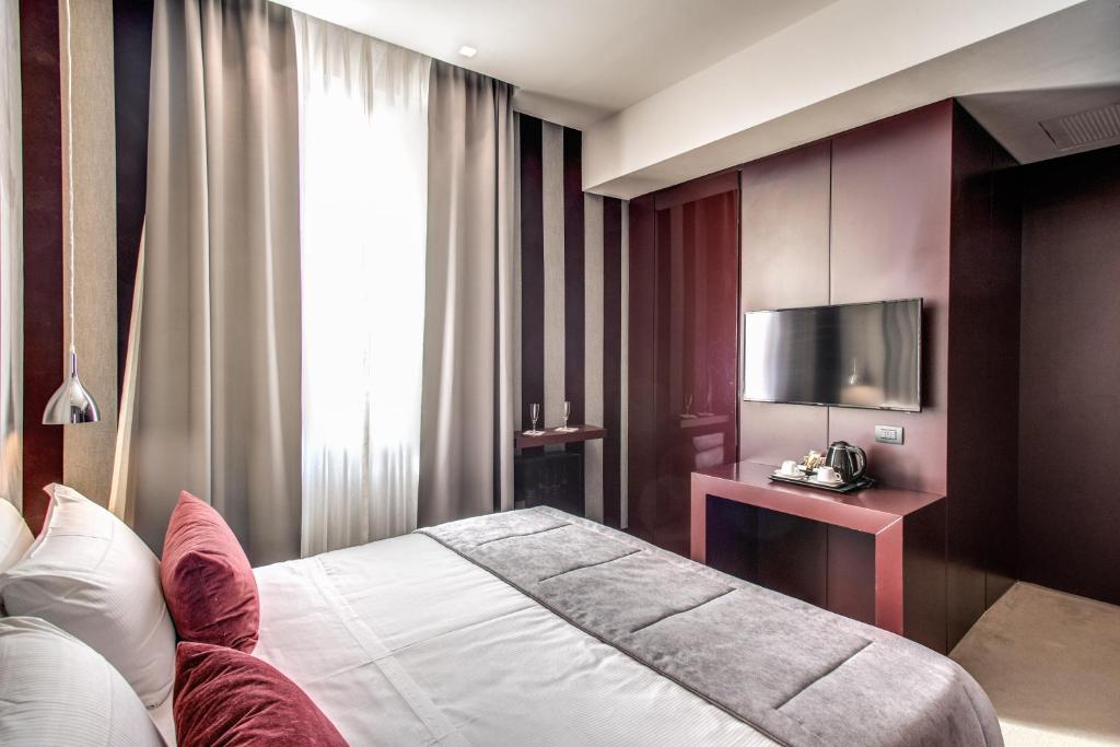 Postel nebo postele na pokoji v ubytování Doria Palace Boutique Hotel