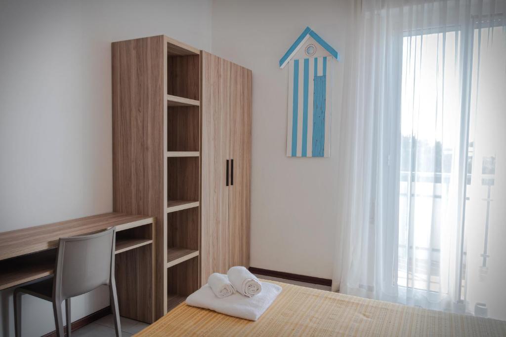 Postel nebo postele na pokoji v ubytování Hotel Astrid