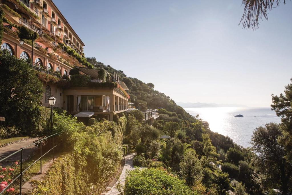 a house on a hill next to the ocean at Splendido, A Belmond Hotel, Portofino in Portofino