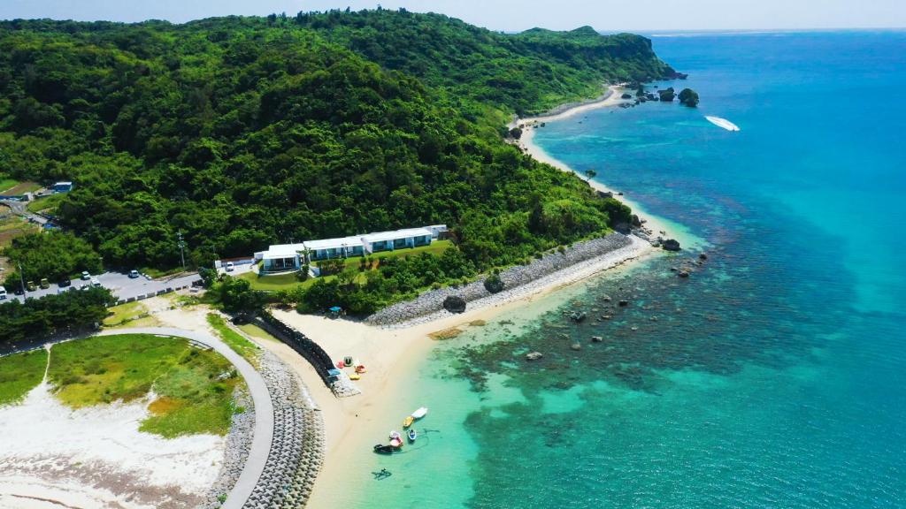 an aerial view of a beach and the ocean at 413 Hamahiga Hotel＆Cafe in Uruma