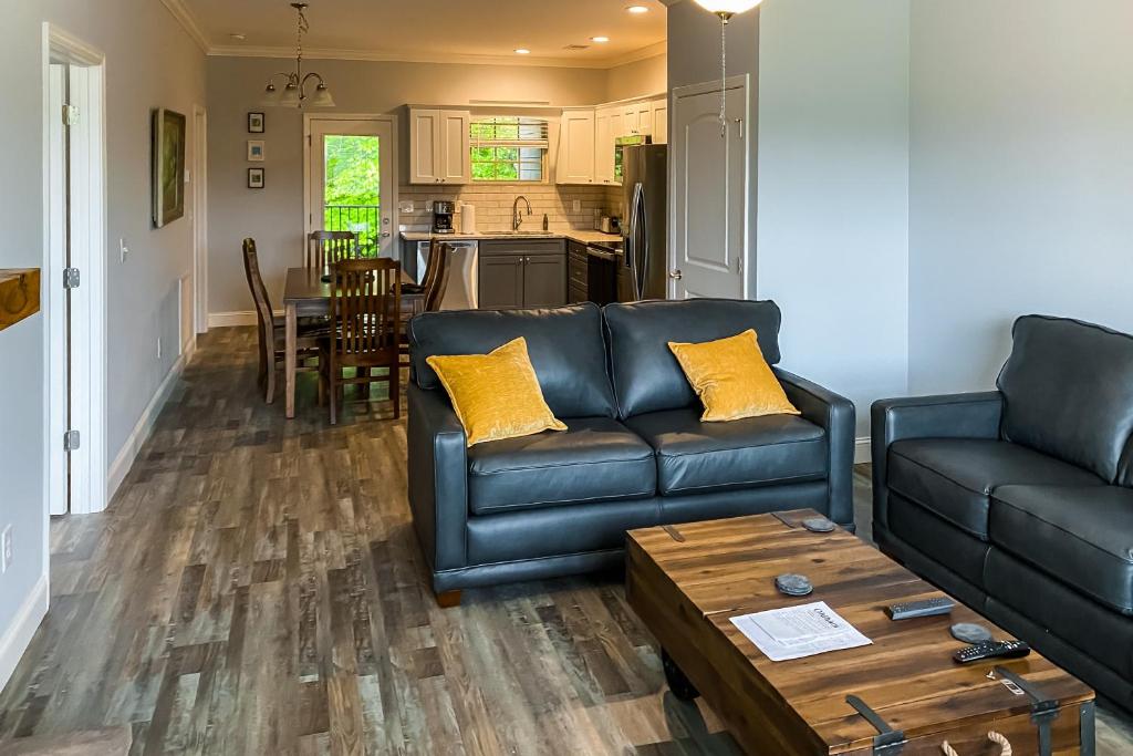 a living room with a couch and a table at Townsend Timbers in Townsend