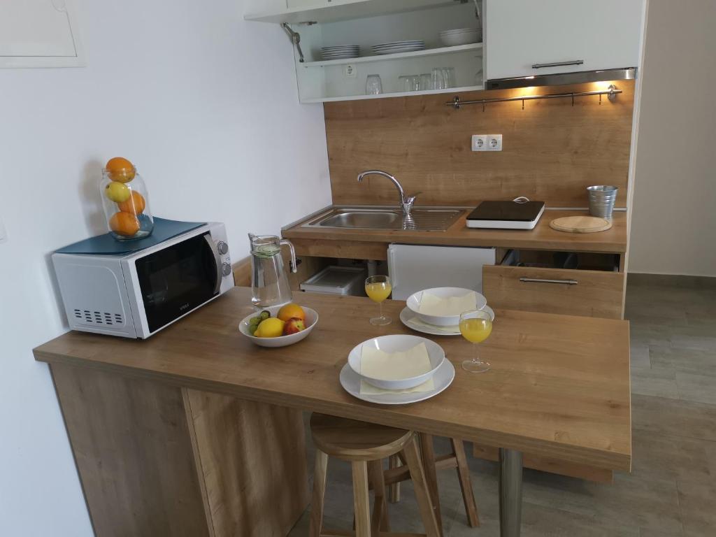 Kuchyň nebo kuchyňský kout v ubytování Apartments ZINA