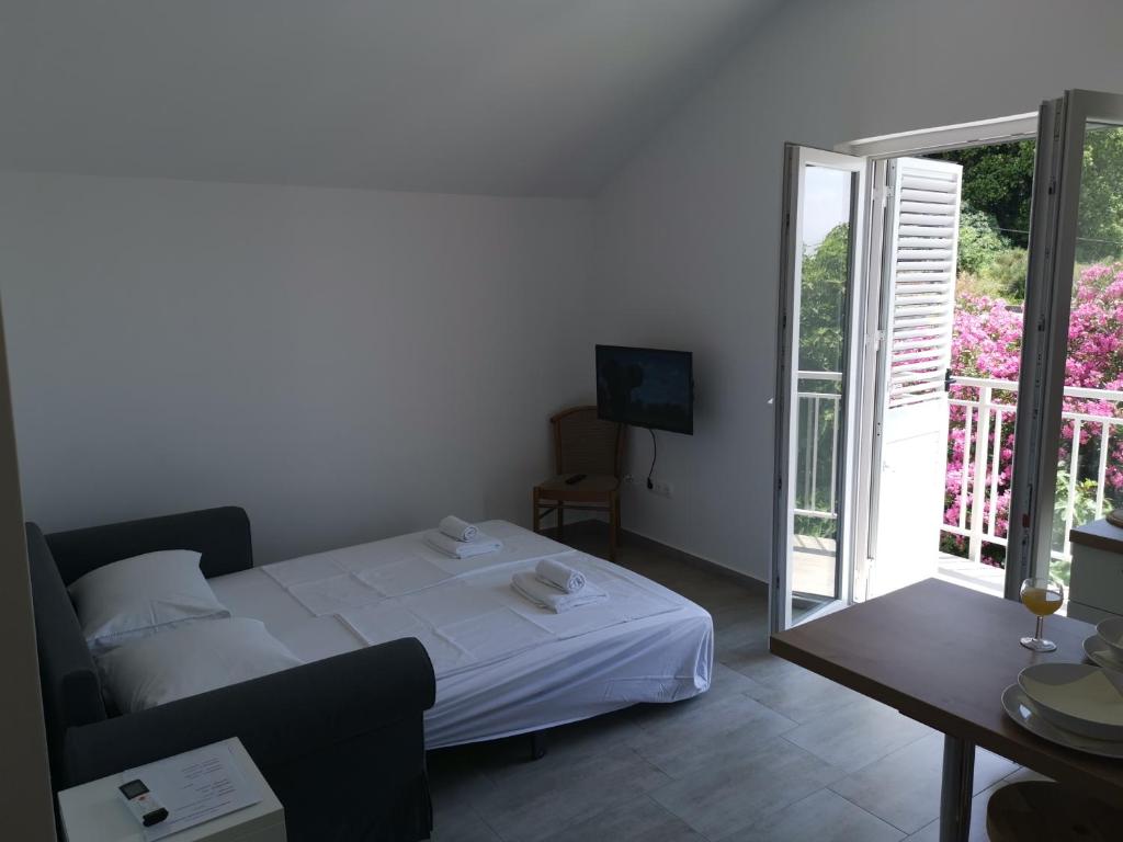 Postel nebo postele na pokoji v ubytování Apartments ZINA