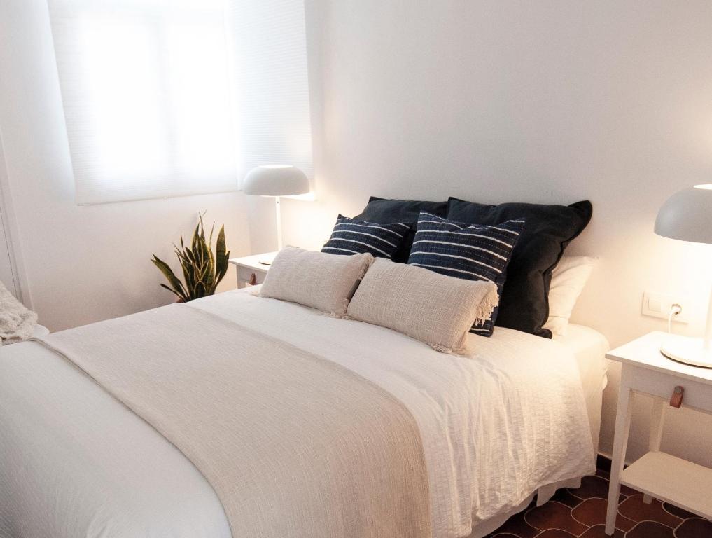 Postel nebo postele na pokoji v ubytování Casa Blanca Beach Apartment