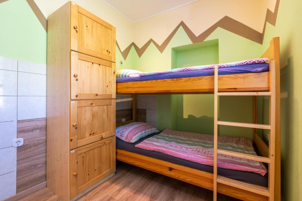 a bunk bed room with two bunk beds at Bled Hostel in Bled