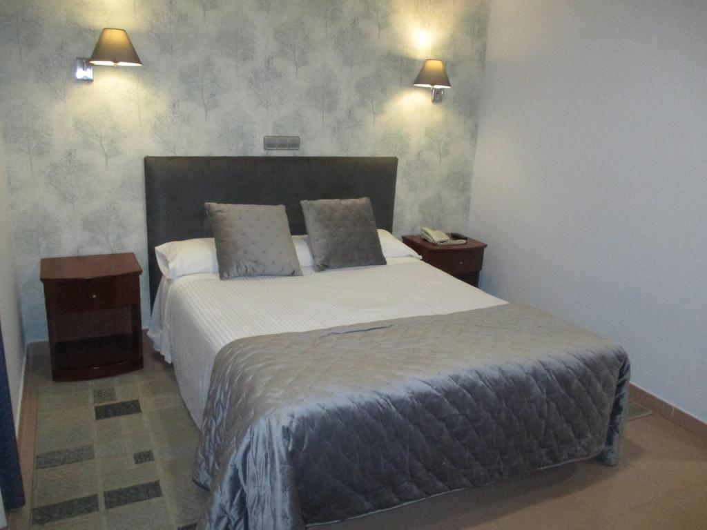 Postel nebo postele na pokoji v ubytování Hotel Las Moradas