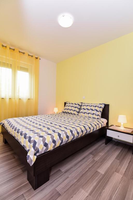 Posteľ alebo postele v izbe v ubytovaní Nova Apartments