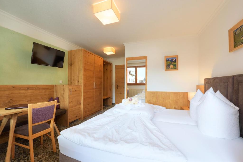 Postel nebo postele na pokoji v ubytování Aparthotel Acksteiner