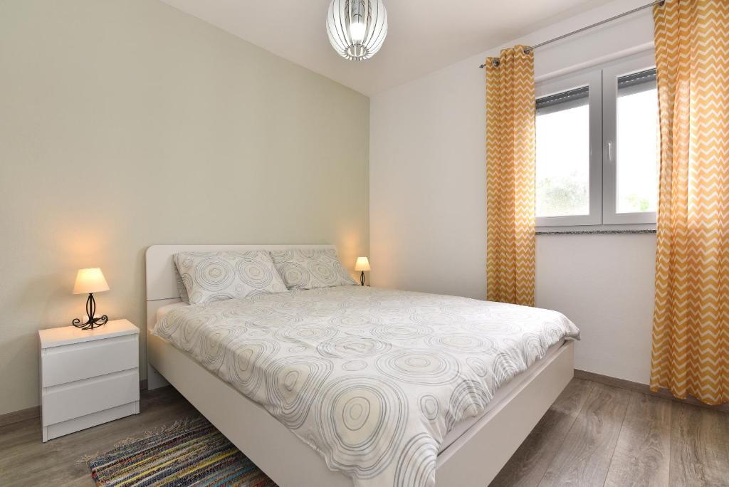Posteľ alebo postele v izbe v ubytovaní Nova Apartments