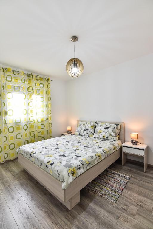 Posteľ alebo postele v izbe v ubytovaní Nova Apartments