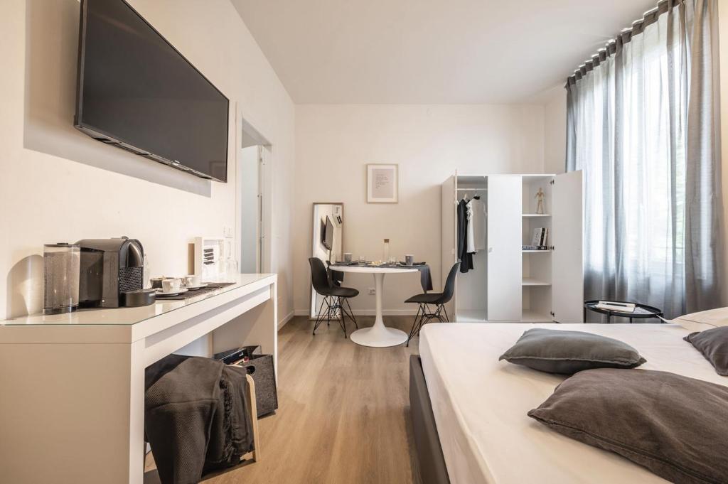 Postel nebo postele na pokoji v ubytování Emilia Suite Essence