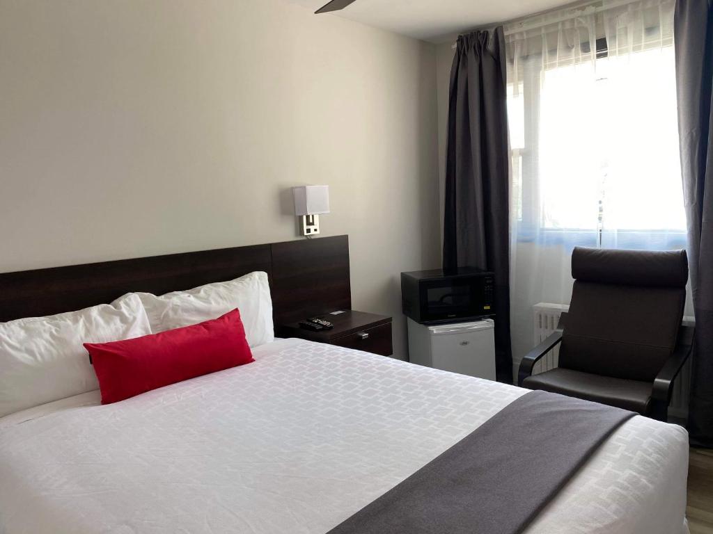 Postel nebo postele na pokoji v ubytování Motel Lévis