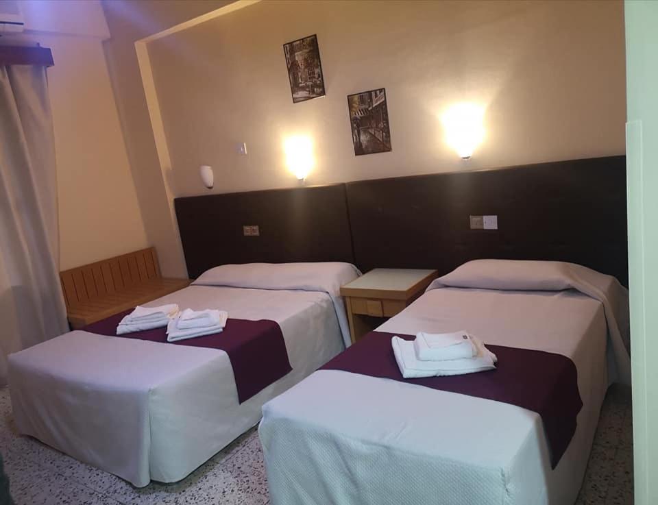 Postel nebo postele na pokoji v ubytování Minaides Hotel