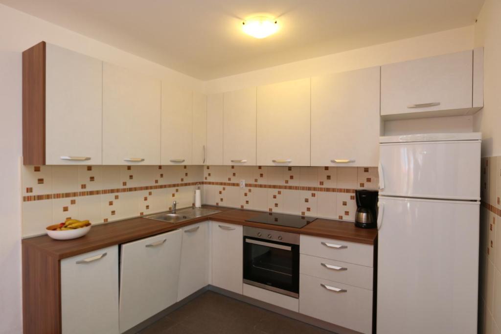Kuchyň nebo kuchyňský kout v ubytování Apartments Grskovic G. Jesenovica