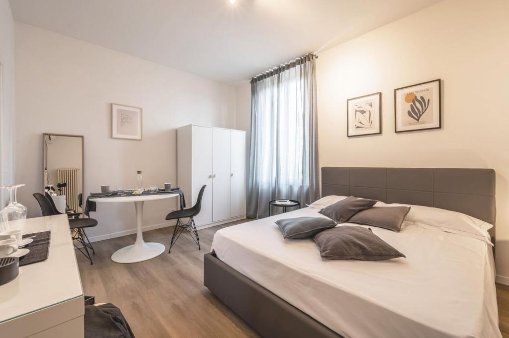 Postel nebo postele na pokoji v ubytování Emilia Suite Essence