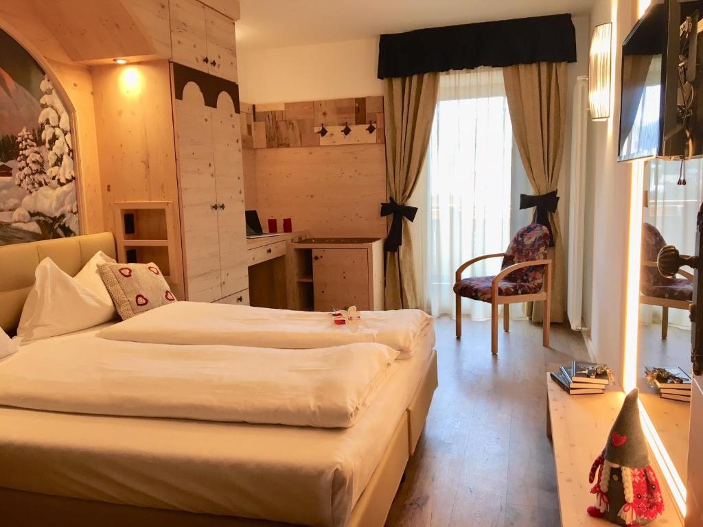 Postel nebo postele na pokoji v ubytování Hotel Laurino