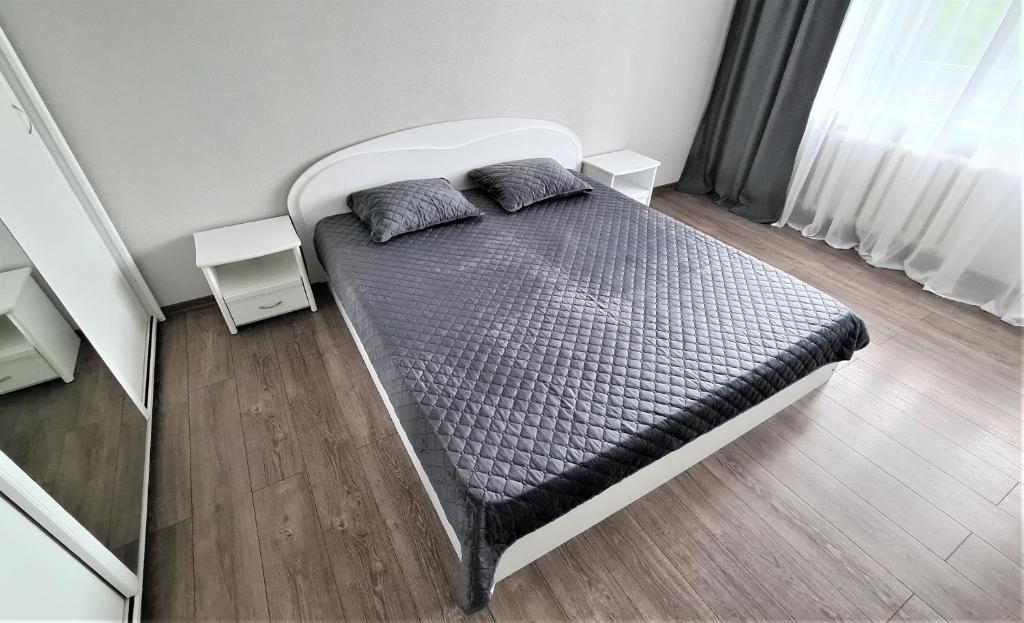 Łóżko lub łóżka w pokoju w obiekcie Green View Apartment