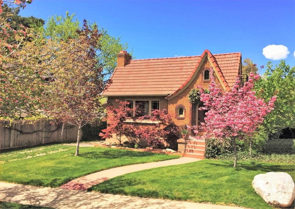 a house with a pathway in front of it at 6-Bedroom Tudor in the Downtown Historic District in Salt Lake City