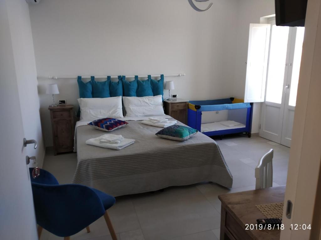 Postel nebo postele na pokoji v ubytování La Casa dei Panorami di Colobraro