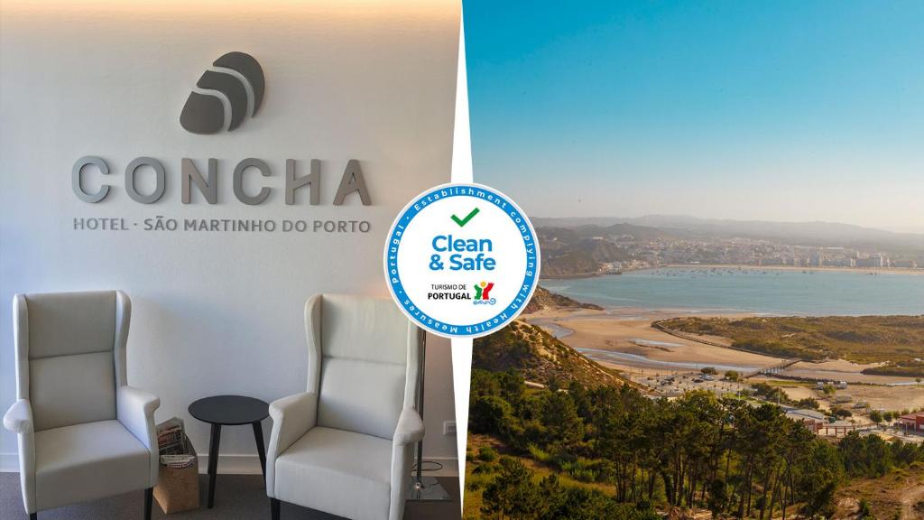 a meeting room with a view of the ocean and a sign at Hotel Concha in São Martinho do Porto