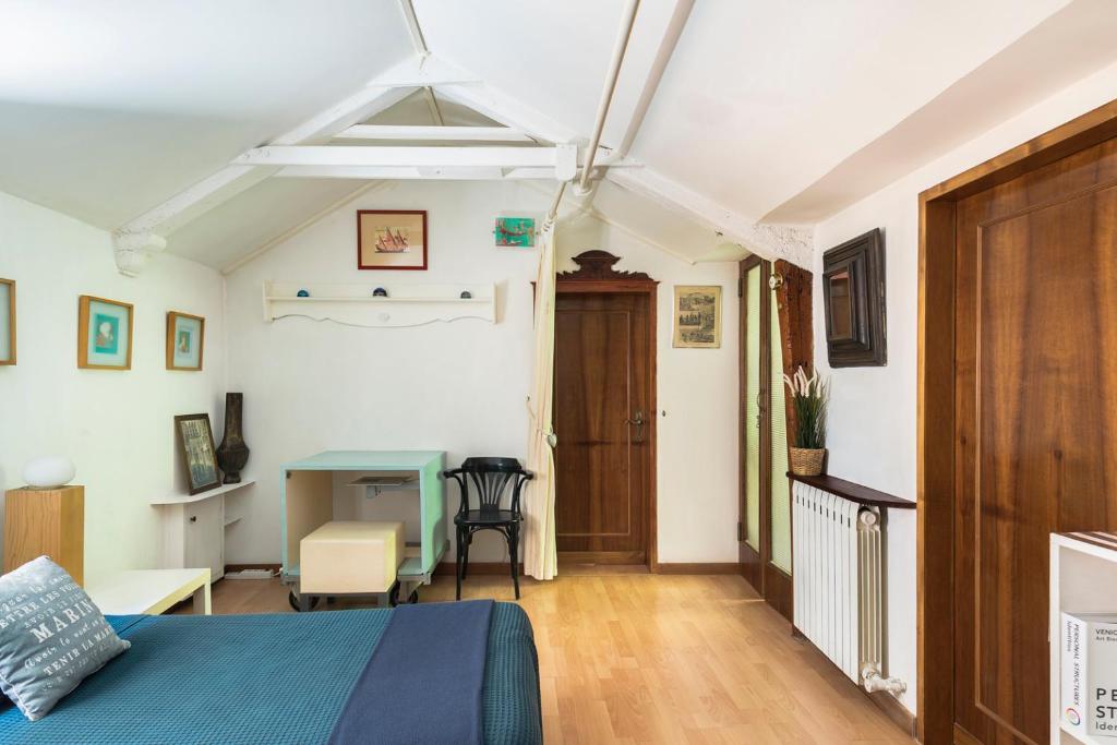 Televízia a/alebo spoločenská miestnosť v ubytovaní Ca Lorosa Cosy and comfortable Loft at Castello