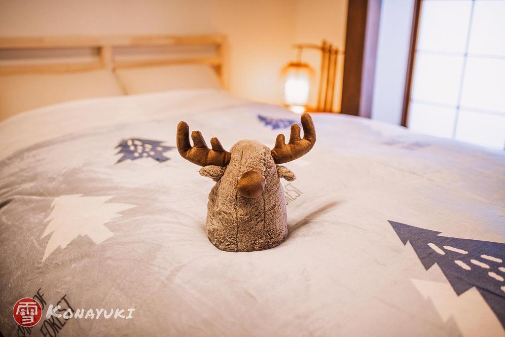 Postel nebo postele na pokoji v ubytování KONAYUKI