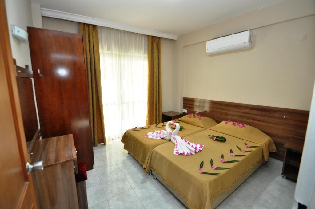 Postel nebo postele na pokoji v ubytování Speedy Apart Otel