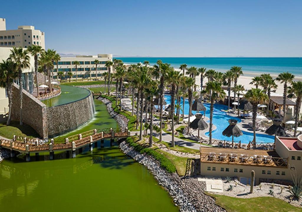 an aerial view of a resort with a pool and the ocean at Vidanta Puerto Peñasco in Puerto Peñasco