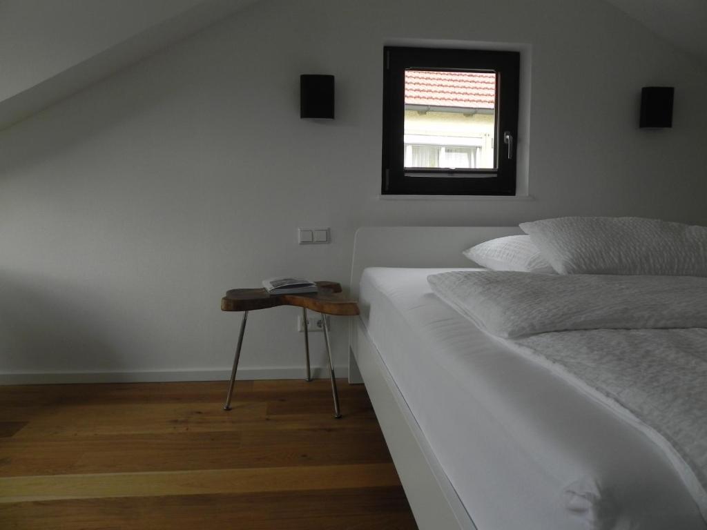 Postel nebo postele na pokoji v ubytování Milchhaus Zimmer - Tiny House