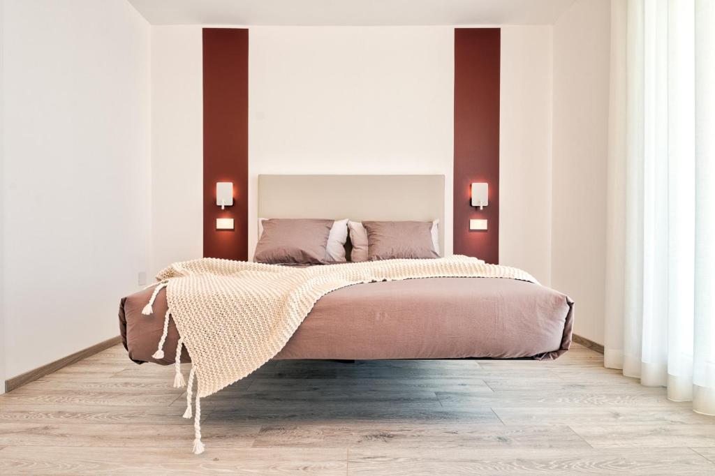 Voodi või voodid majutusasutuse Albamarina Residence toas