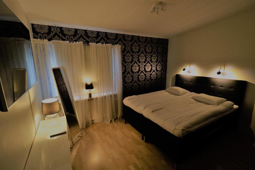 Postel nebo postele na pokoji v ubytování RIBO Apartment Aurora