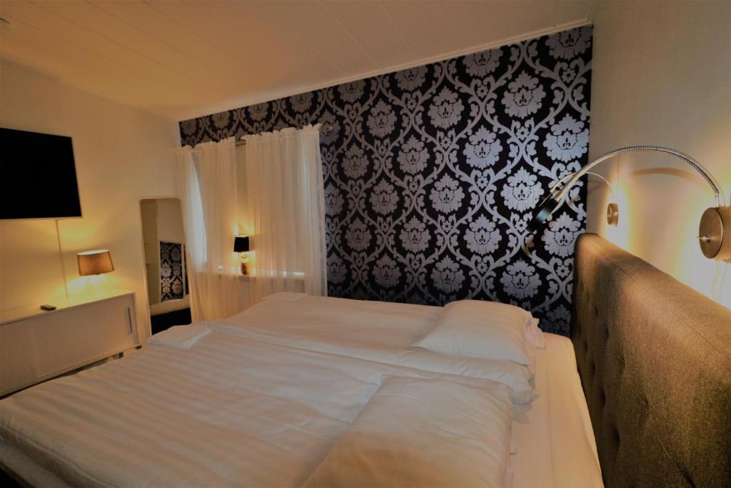 Postel nebo postele na pokoji v ubytování RIBO Apartment Aurora