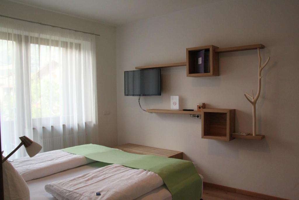 TV a/nebo společenská místnost v ubytování Residence die Färbe