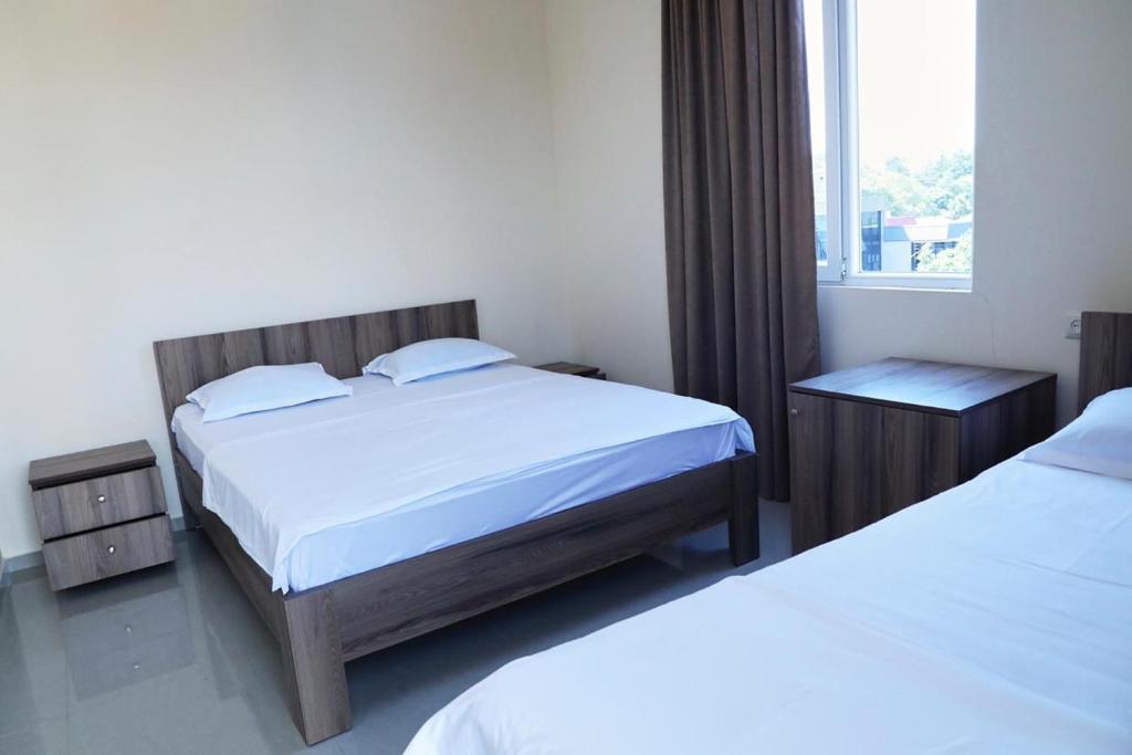 Rúm í herbergi á Hotel Estonia Two