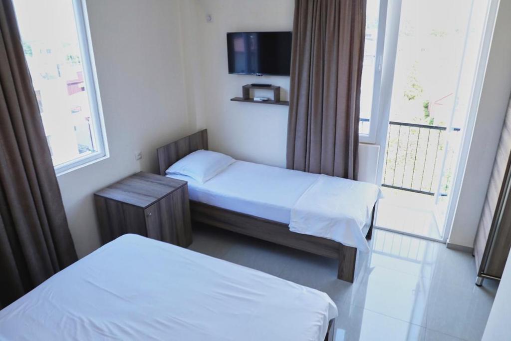 Rúm í herbergi á Hotel Estonia Two