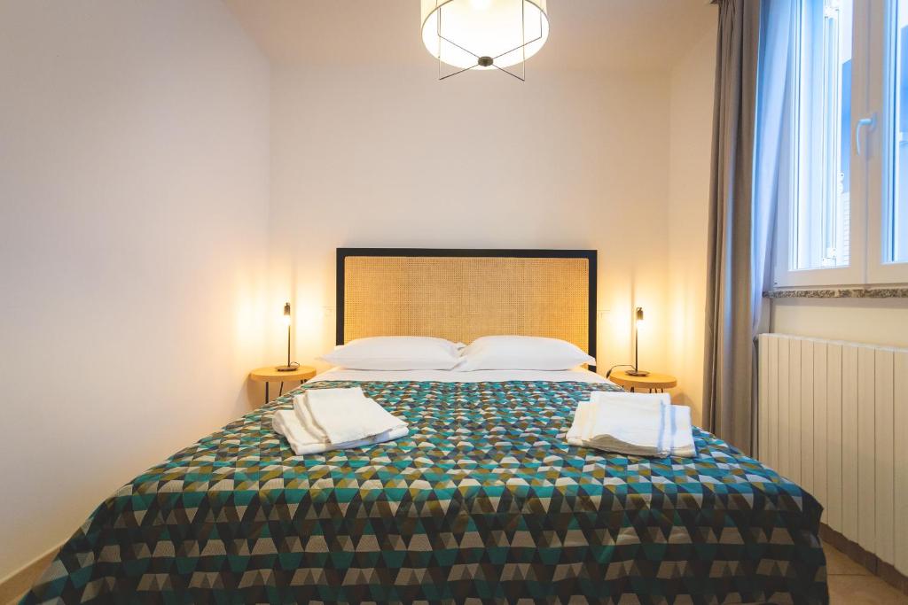 Posteľ alebo postele v izbe v ubytovaní Via Siena 4 - Suites & Rooms