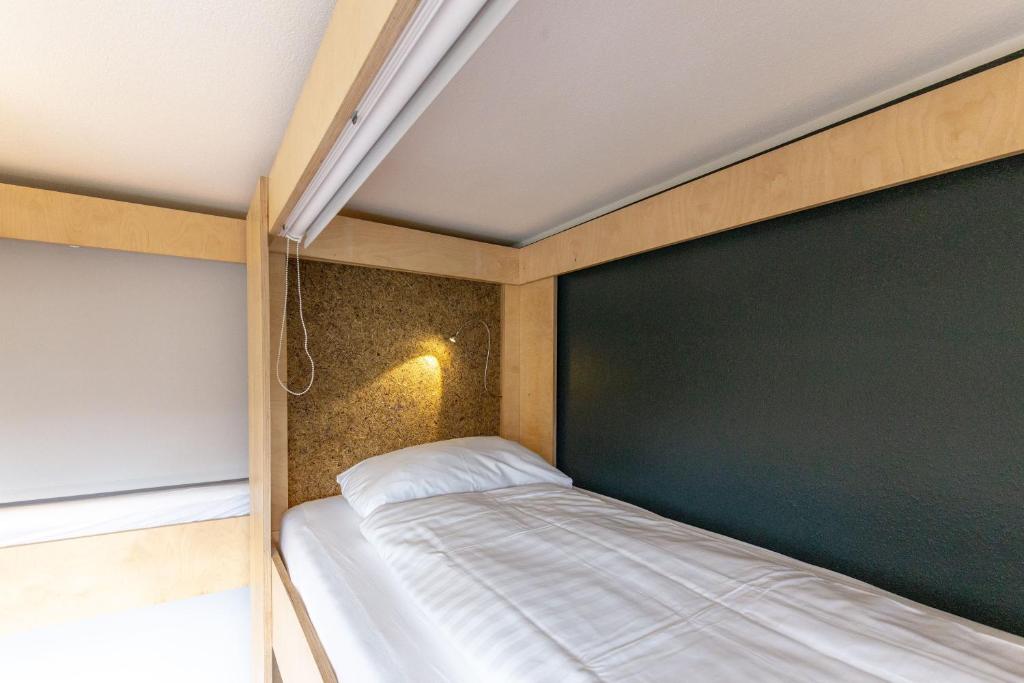 Postel nebo postele na pokoji v ubytování Hostel by Hyve Basel