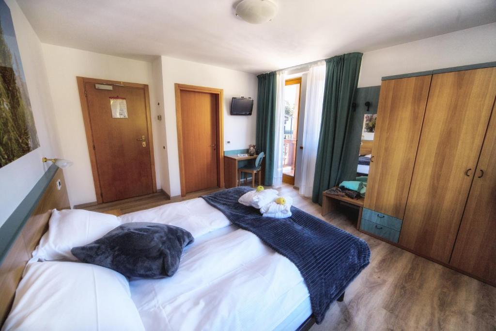 Postel nebo postele na pokoji v ubytování Hotel Fantelli