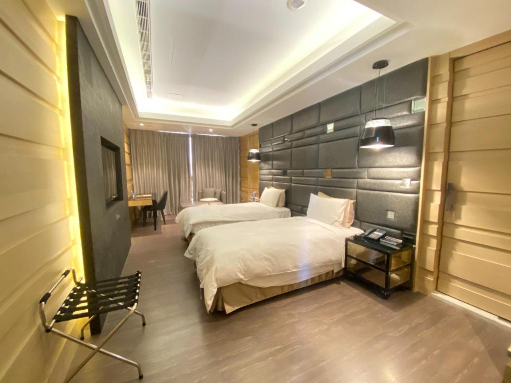 Katil atau katil-katil dalam bilik di U-Her Hotel