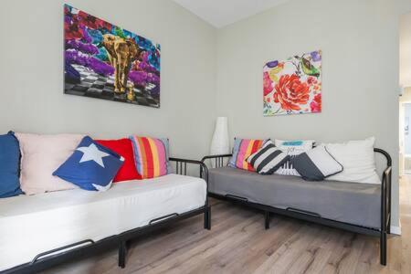 two beds with pillows on them in a room at Camp Nou , Fira Barcelona Apartment in Hospitalet de Llobregat