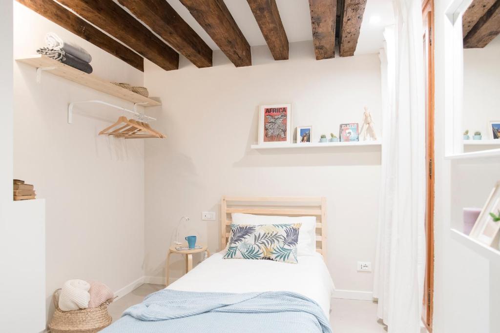 Postel nebo postele na pokoji v ubytování Mirandolina Venice Exclusive Guesthouse