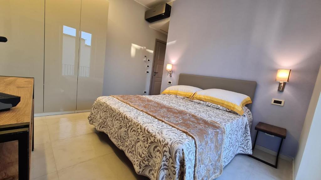 Posteľ alebo postele v izbe v ubytovaní B&B La Piazzetta