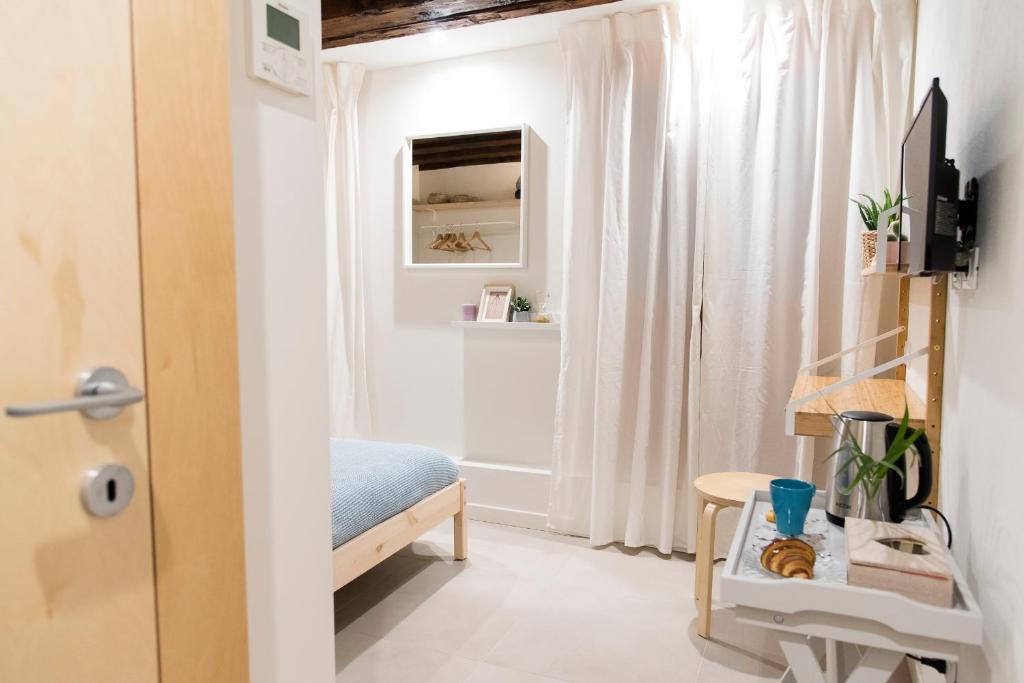 TV a/nebo společenská místnost v ubytování Mirandolina Venice Exclusive Guesthouse