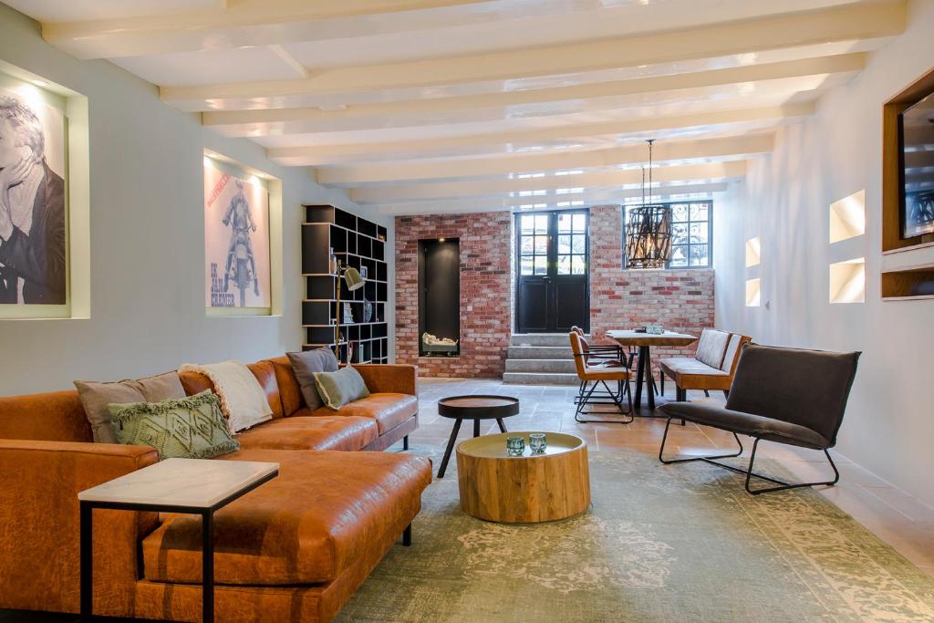 a living room with a couch and a table at Beautiful Apartment City Centre Amsterdam in Amsterdam