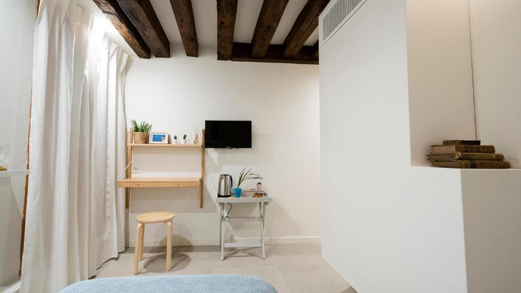 TV a/nebo společenská místnost v ubytování Mirandolina Venice Exclusive Guesthouse