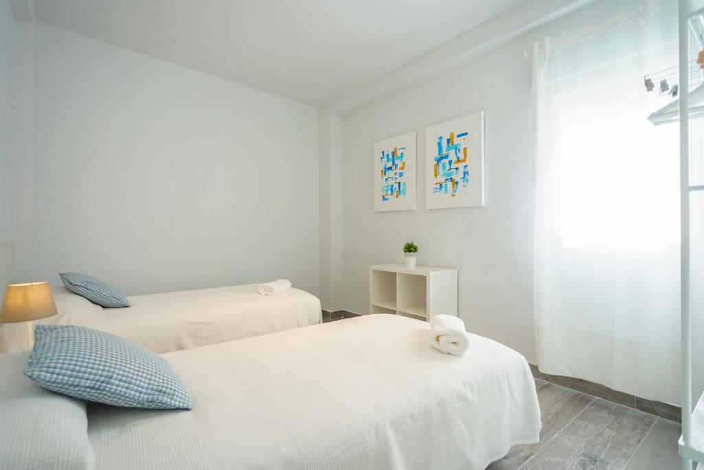 Posteľ alebo postele v izbe v ubytovaní CASANA APARTAMENT CITY CENTER