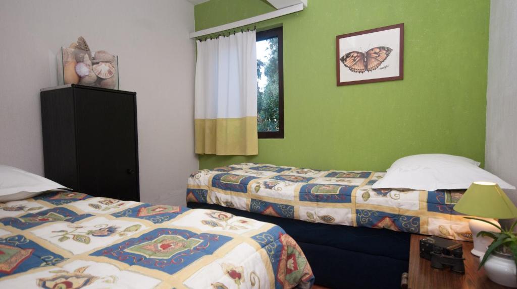 Postel nebo postele na pokoji v ubytování Apartmani Jagoda